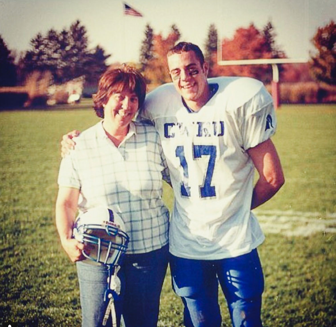 John Kobs in his number 17 Case Western football jersey with his mother Judy