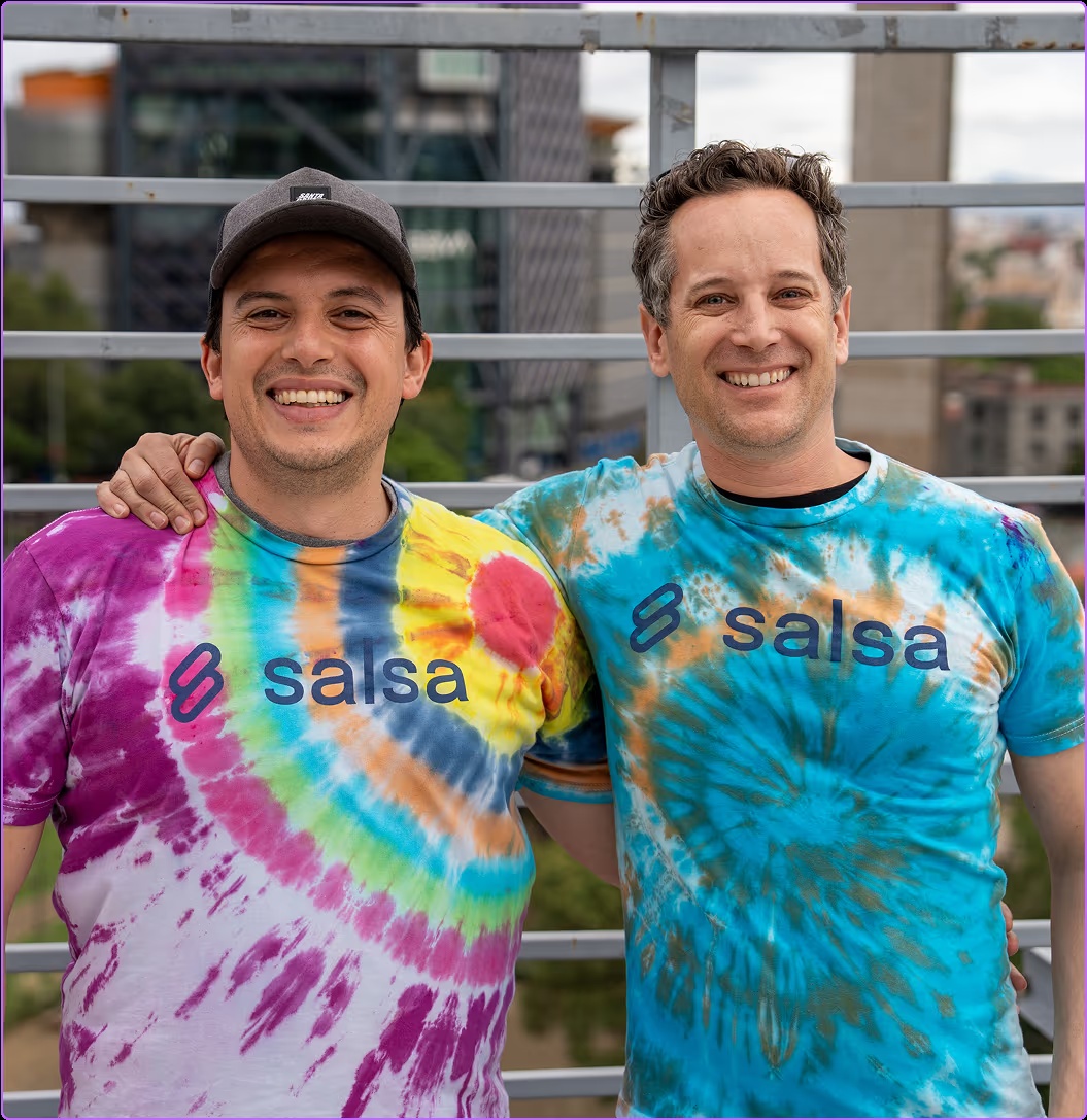 John Kramer, on the right, and a teammate wearing colorful Salsa T-shirts