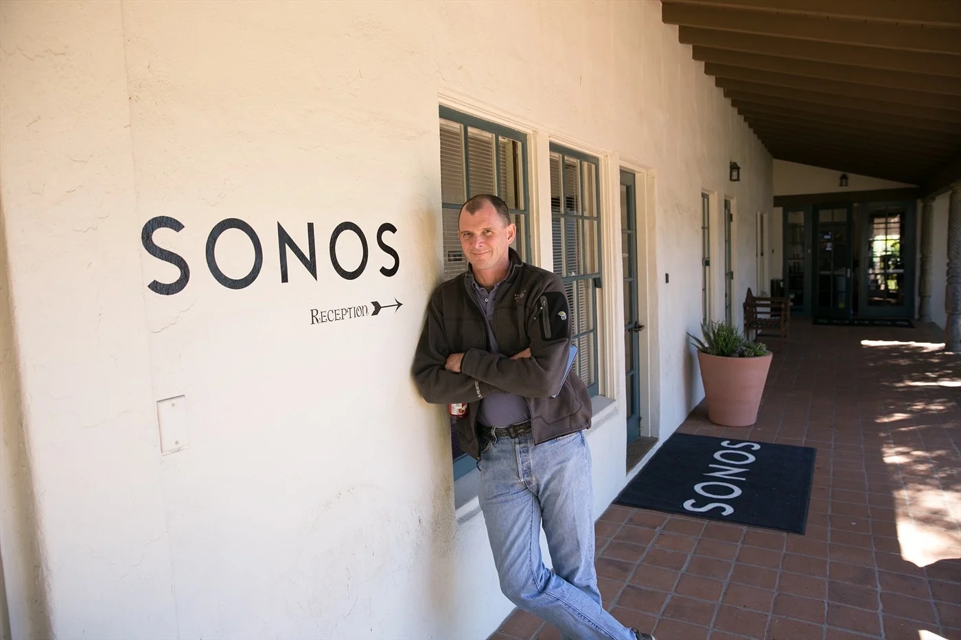 John MacFarlane standing beside the Sonos reception entrance