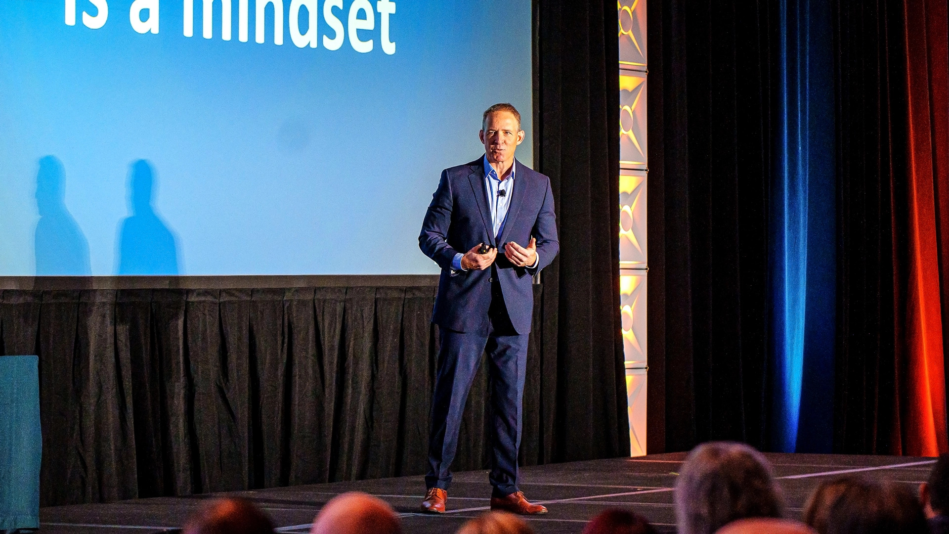 John Merrill speaking onstage at the 2025 Laserfiche Empower conference