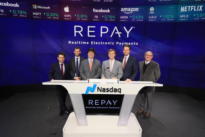 John Morris, fourth from left, with REPAY colleagues and investors at Nasdaq