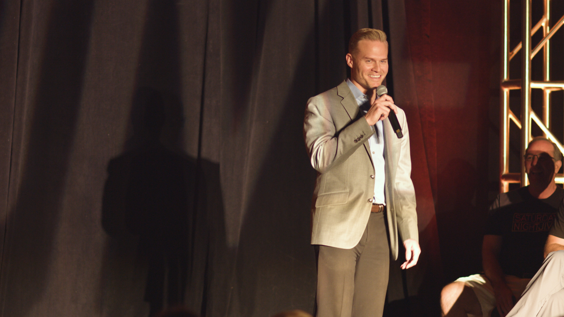 John Pope speaking into a microphone at a Jive gathering