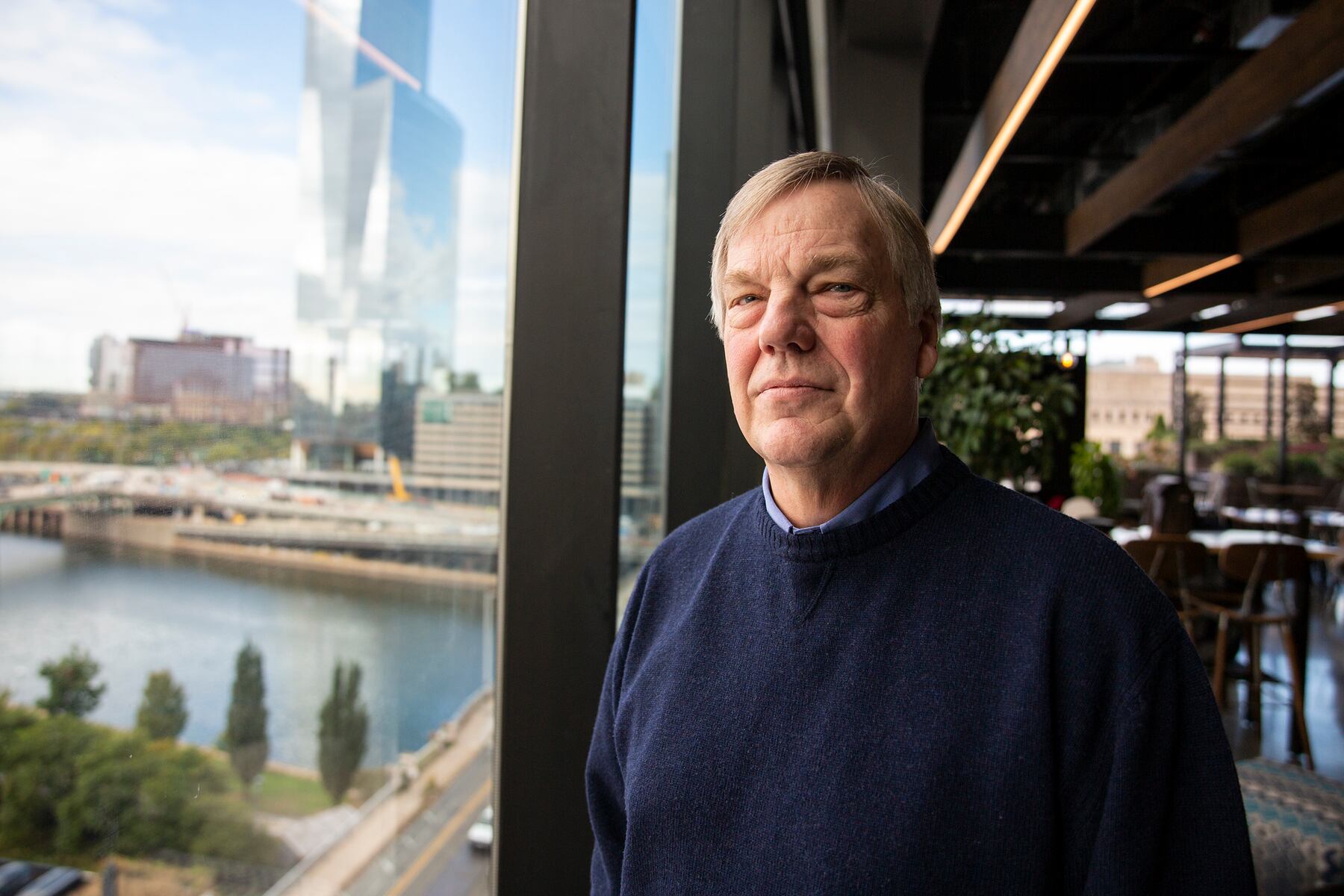 John Zillmer beside the windows at Aramark’s Philadelphia headquarters in October 2019