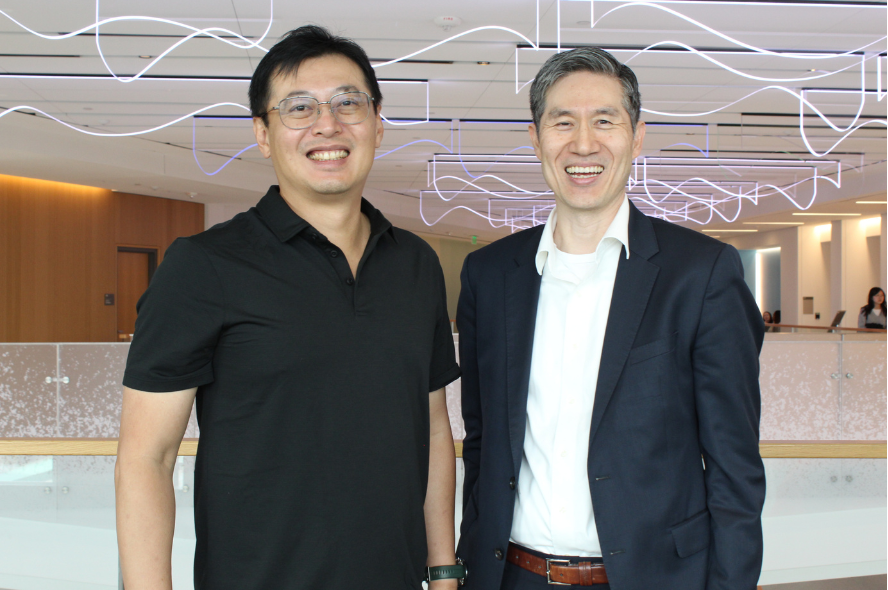 Johnson Lee, left, and Tufts engineering dean Kyongbum Lee stand together at the Joyce Cummings Center.