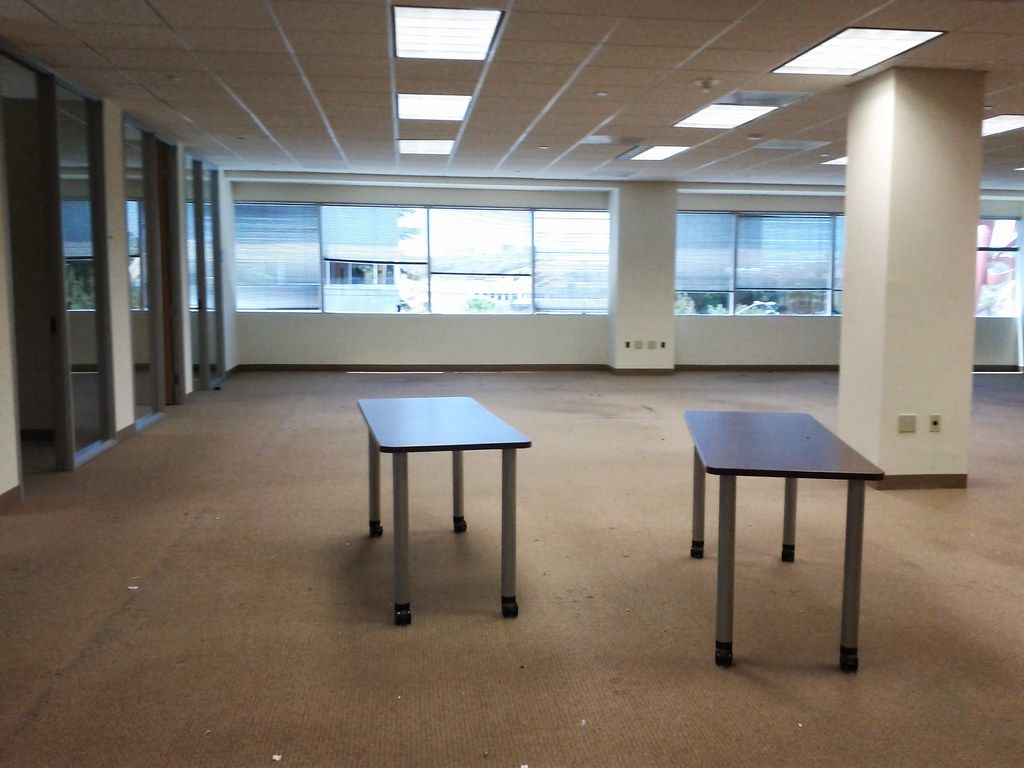 A largely empty office with two tables, pictured in O'Bryan's founding sales-development hiring post