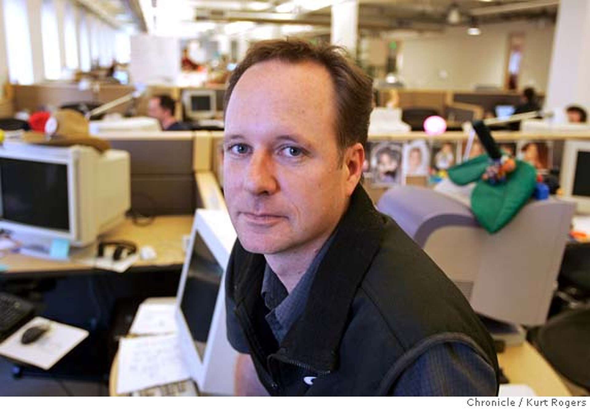 Jonathan Nelson seated among computers and cubicles at Organic’s San Francisco office in 2005