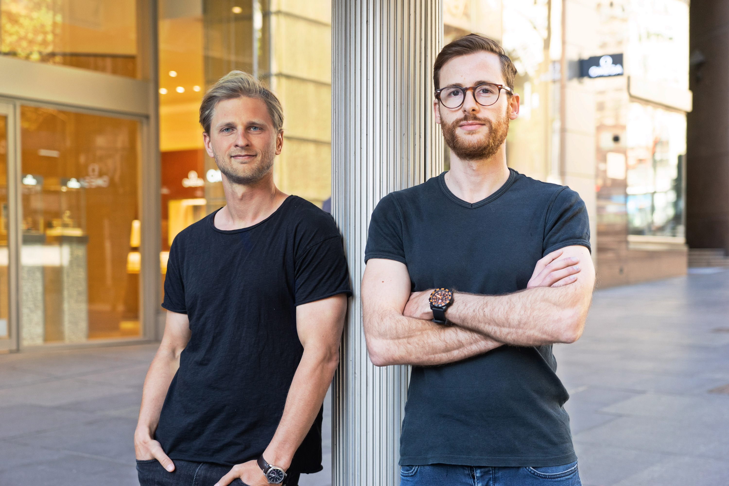 Deferit co-founders Mat Blas, left, and Jonty Hirsowitz, right, standing outside a building