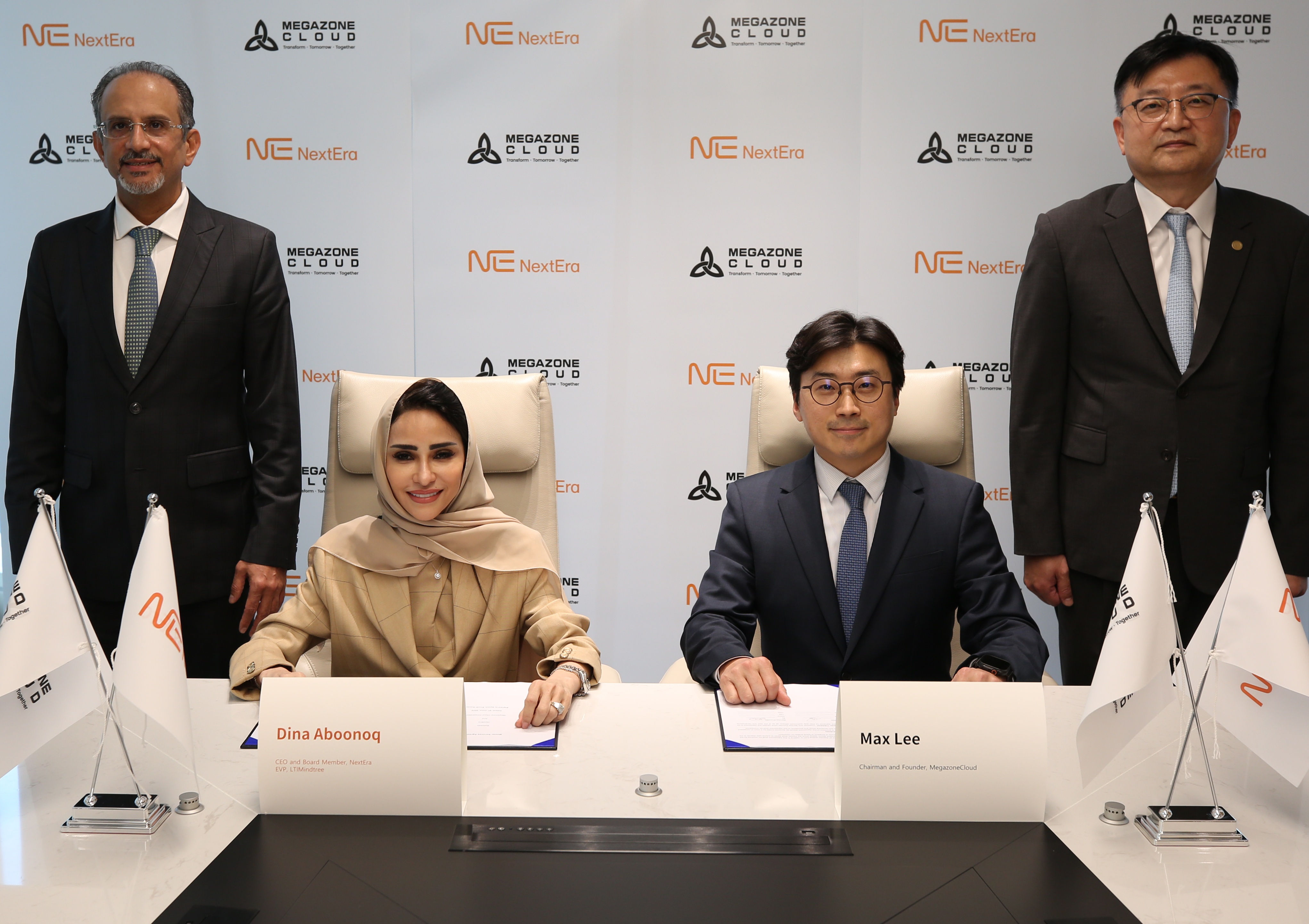 Joowan Lee, seated right, and NextEra CEO Dina Aboonoq, seated left, at the 2025 agreement signing, with Nabil Al-Nuaim and Jo Jun-hee standing behind them