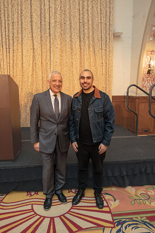 USC engineering dean Yannis Yortsos and Jordan Noone standing together at a university event