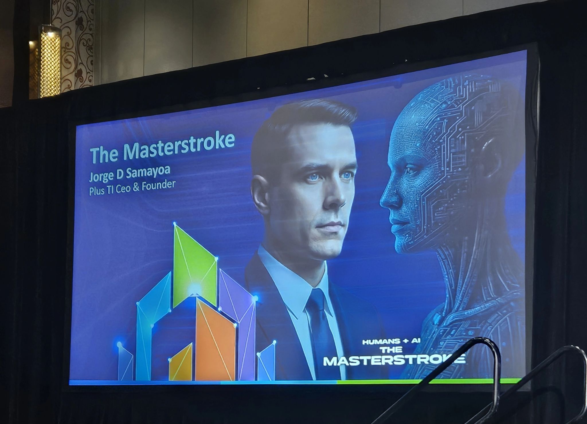 Conference screen for Jorge D Samayoa’s The Masterstroke presentation, with illustrated human and machine faces