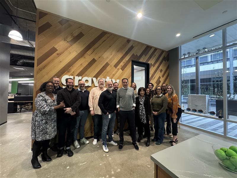 Jose Lozano with colleagues in a Gravity Global office