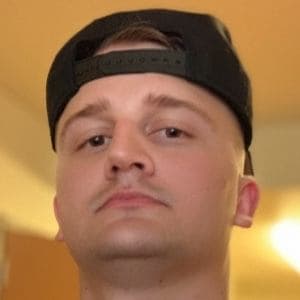 A public photograph of Joseph Drennan, known online as StarMarine, wearing a backwards black cap