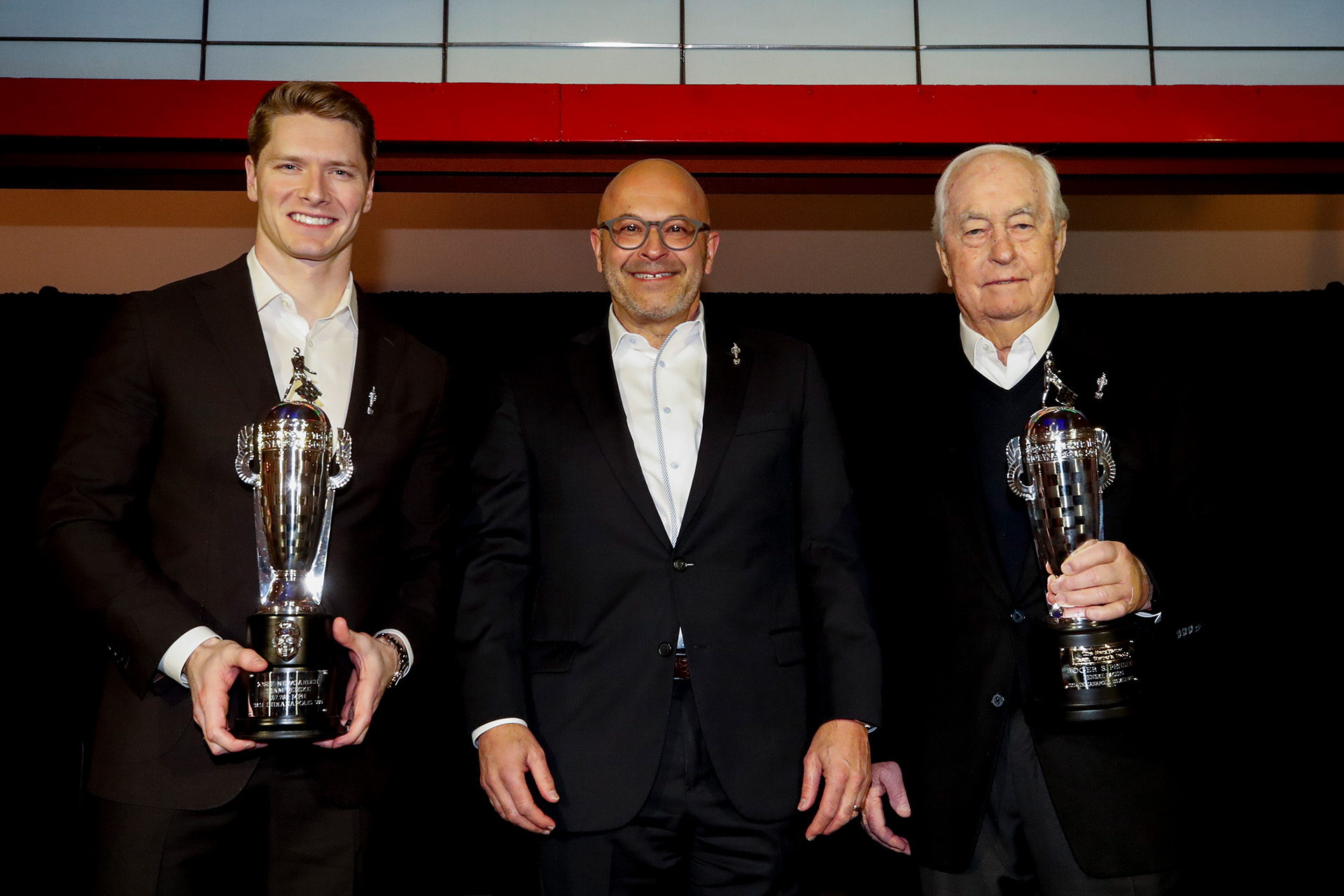 Josef Newgarden, Joseph Fadool and Roger Penske at the January 2025 Baby Borg trophy ceremony