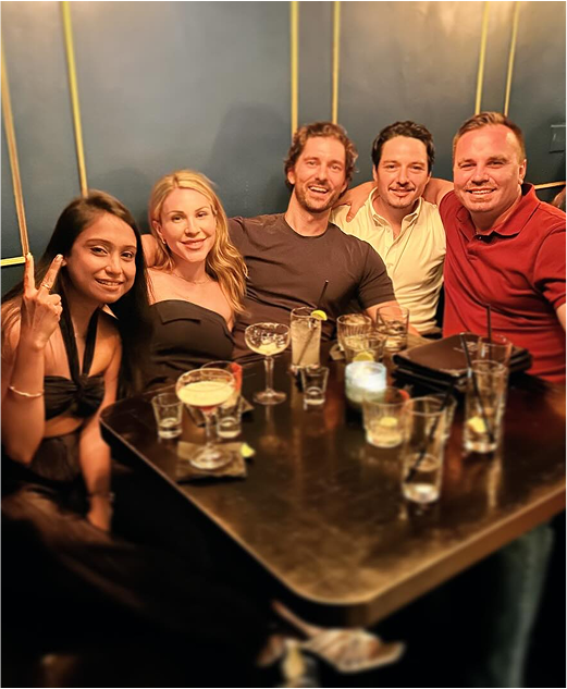 Joseph Ricard at the right of a table with four other people