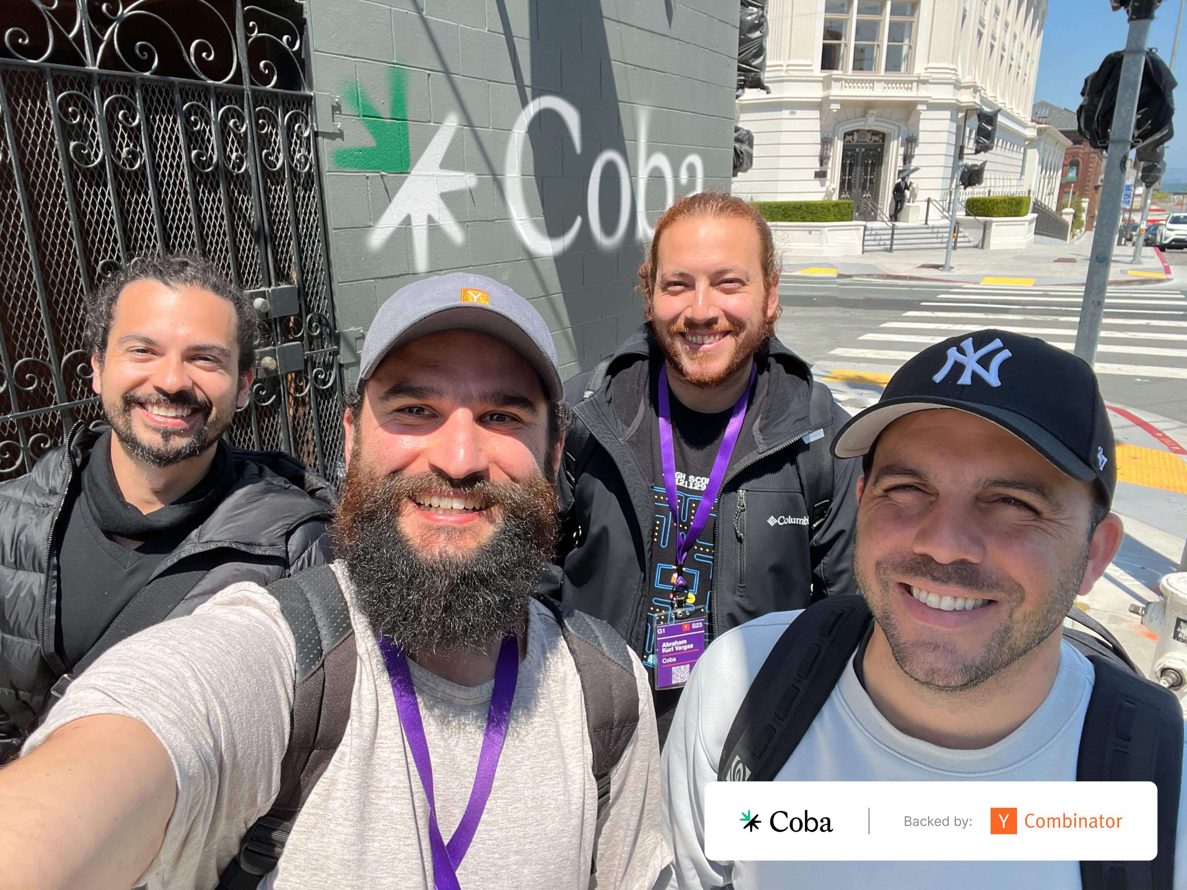 Four members of the Coba founding team together outdoors, with Y Combinator badges; Joseph Saliba is at right.