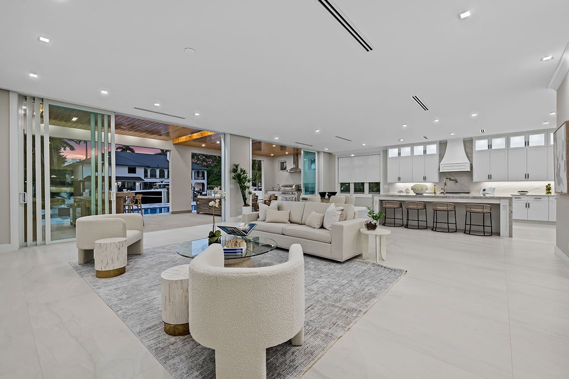 Open living room and kitchen in Dotoli’s rebuilt Las Olas waterfront property