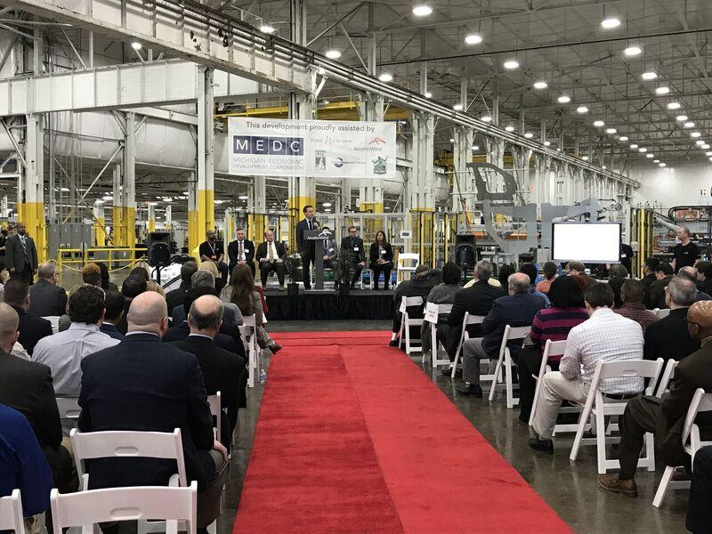 Guests seated inside ArcelorMittal’s Detroit factory at its 2018 opening