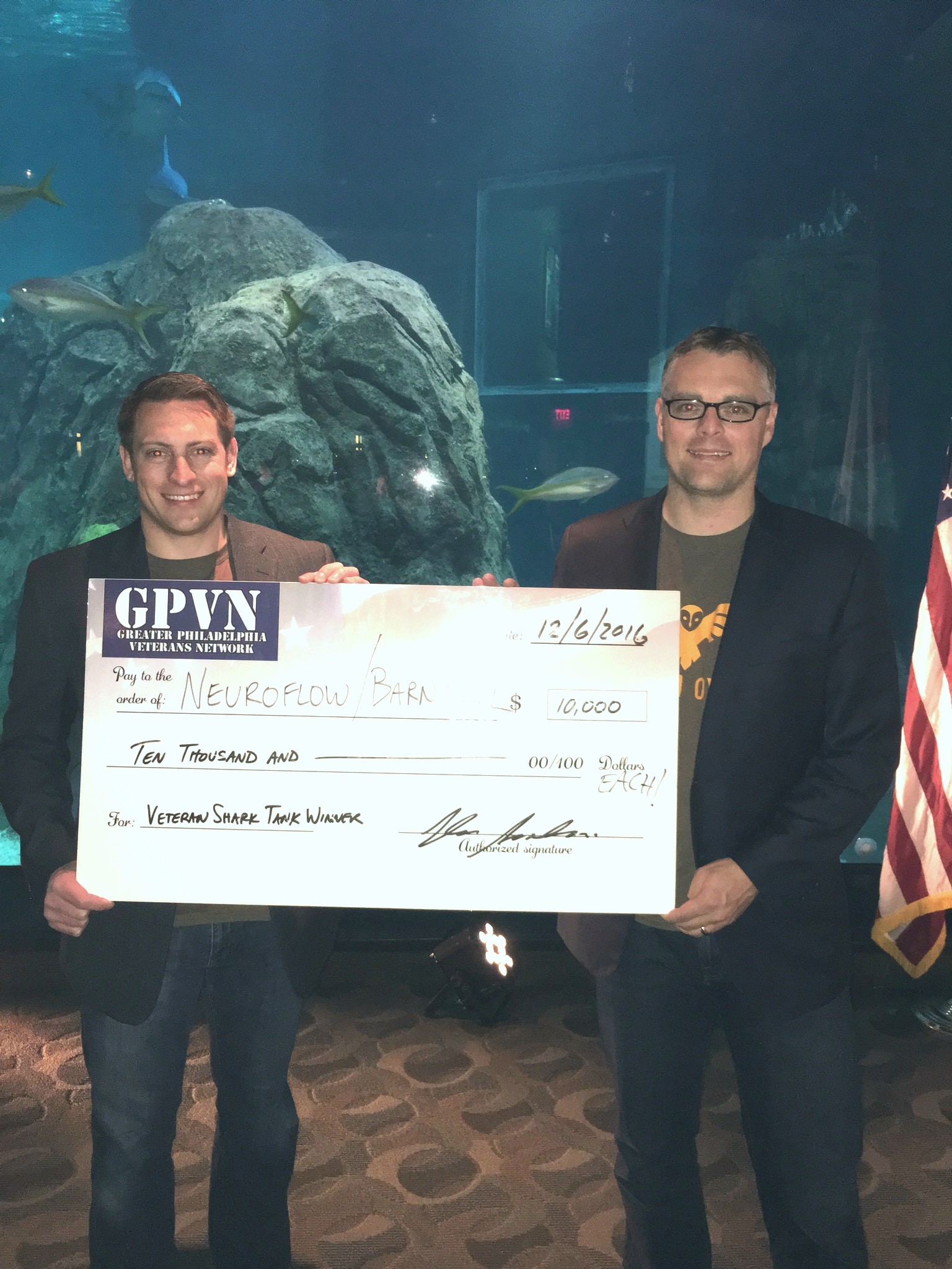 Vincent Kuchar and Josh Phifer holding a prize check at the 2016 Veteran Shark Tank
