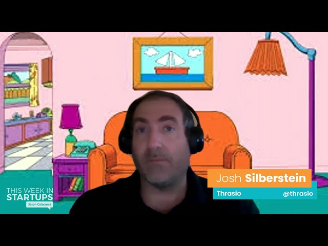 Joshua Silberstein wearing headphones during a remote interview, with a cartoon living room as his background