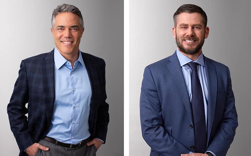 Joshua Weintraub, left, and Bill Kloos, right, in USA Wrestling’s 2021 appointment photograph