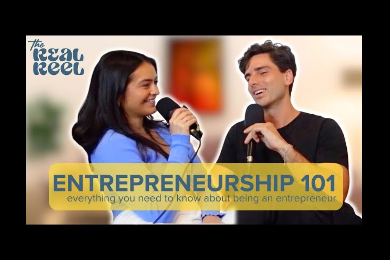Natalie Barbu and Juan Camilo Meisel speaking into microphones on The Real Reel