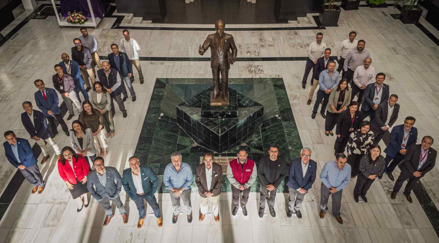 Participants in the Mindset 40 launch gathered in a university atrium around a statue