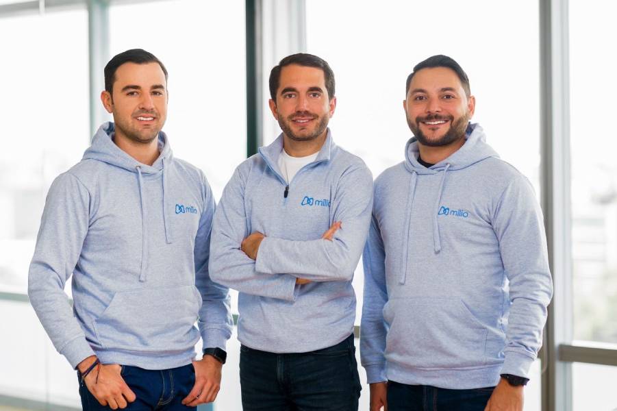 Juan Luis Pérez Escobar, Toni Riera, and Daniel Gómez wearing Milio sweatshirts