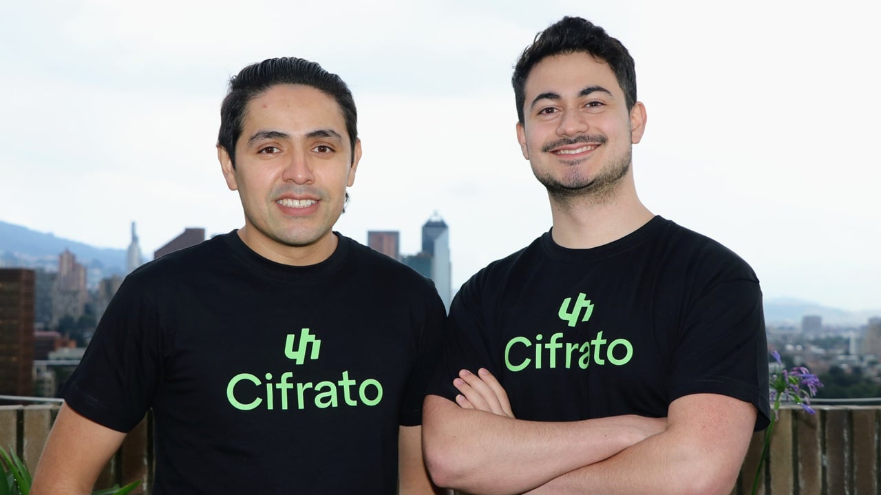 Cifrato cofounders Yerson Cacua and Juan Pisco wearing black Cifrato shirts in Bogotá