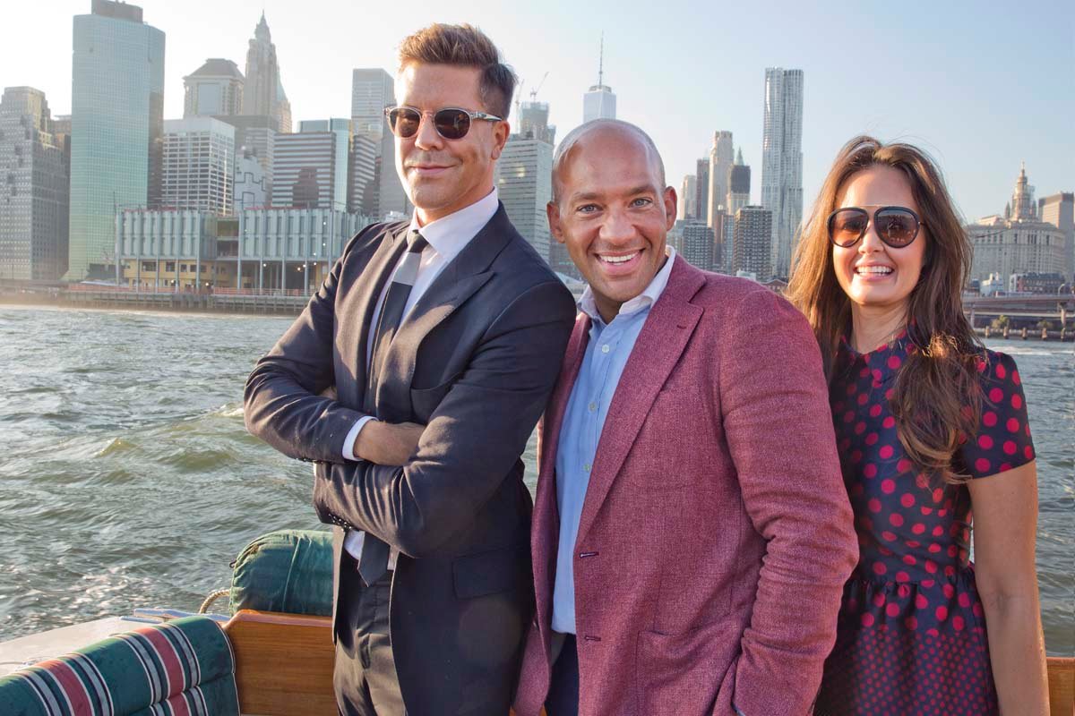 Fredrik Eklund, John Gomes and Julia Spillman together on a boat with the Manhattan skyline behind them