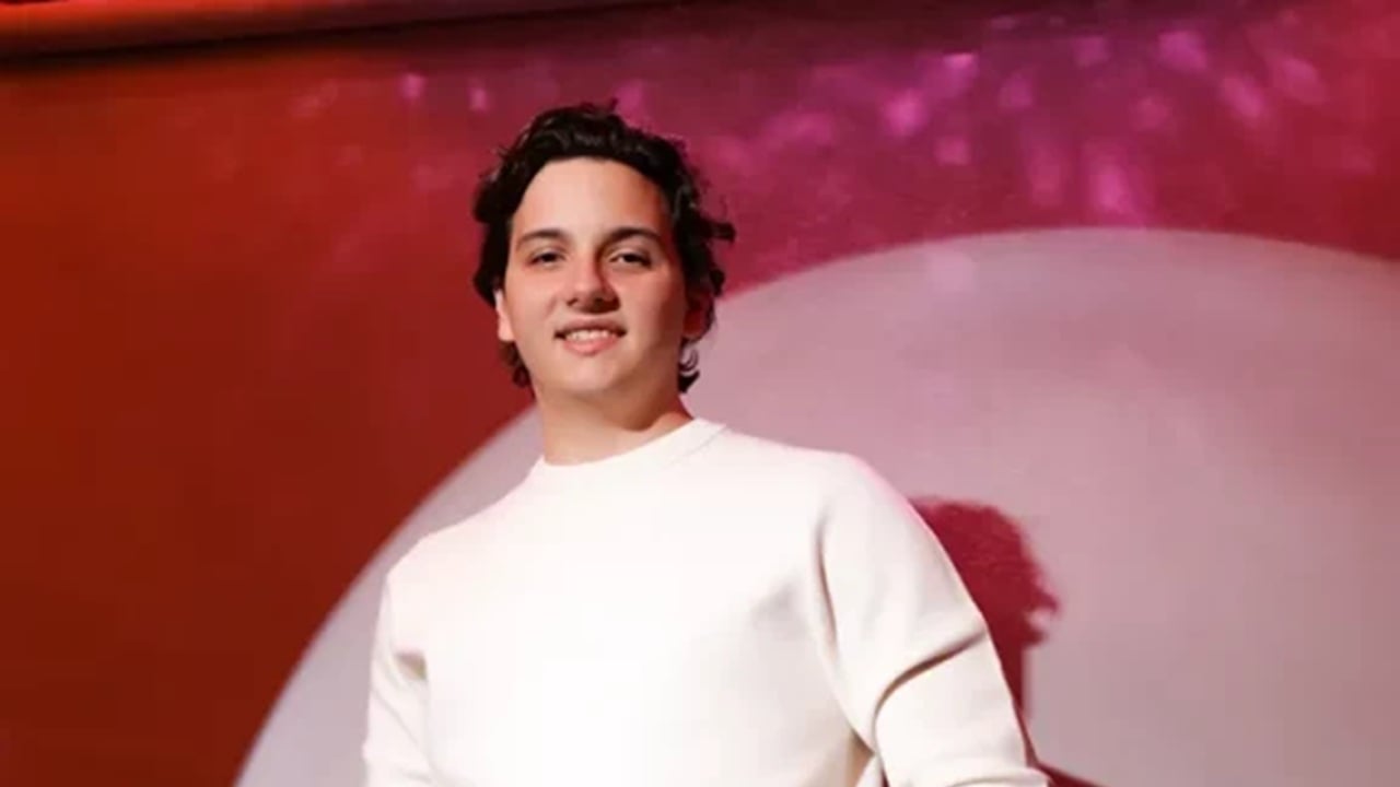 Julián Ríos Cantú in a white shirt against a red and pink backdrop
