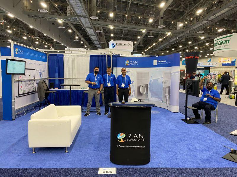 Zan Compute team at its blue exhibition booth at ISSA Show 2021