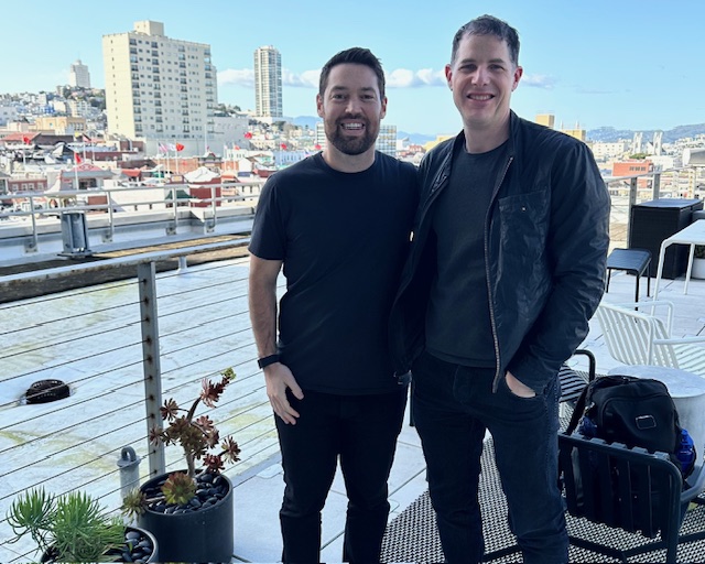 Justin Levine and Matt Gray standing together on a San Francisco terrace