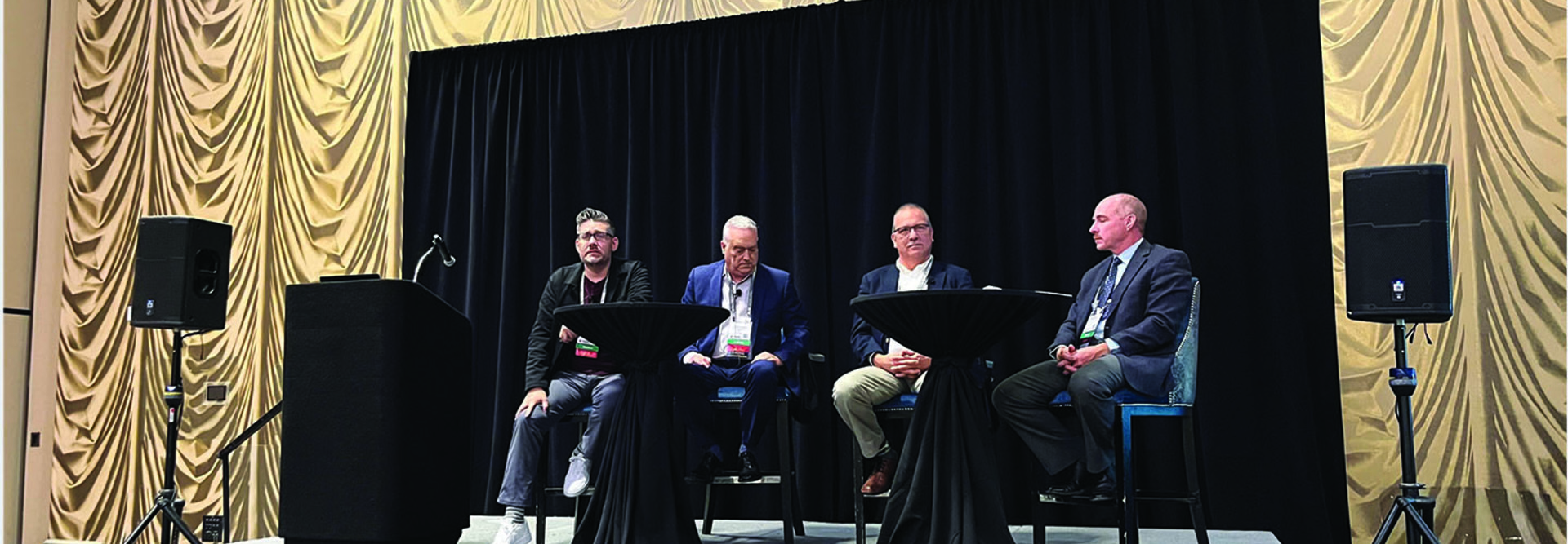 Justin Raisor, seated at left, joins a panel at TribalNet 2024