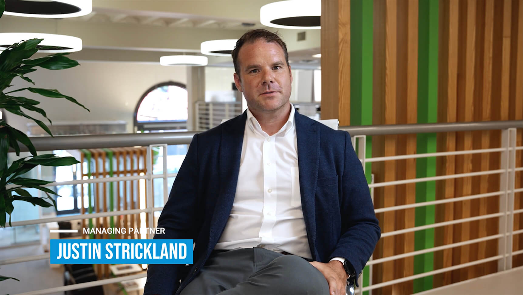 Justin Strickland seated for an Impact Brands interview