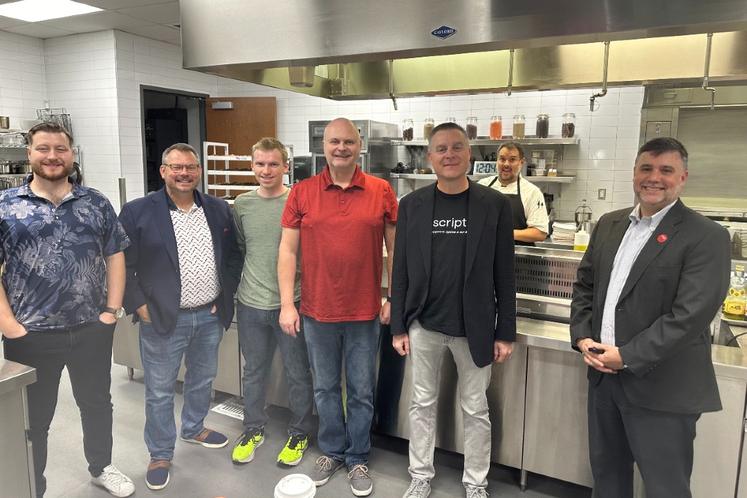 Justin Villiers, at left, with Scription colleagues and dean David Cárdenas, at right, in a university kitchen in Las Vegas.