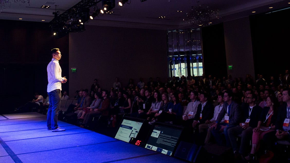 Justin Zhu speaking onstage to an audience at Iterable's Activate 2019 conference
