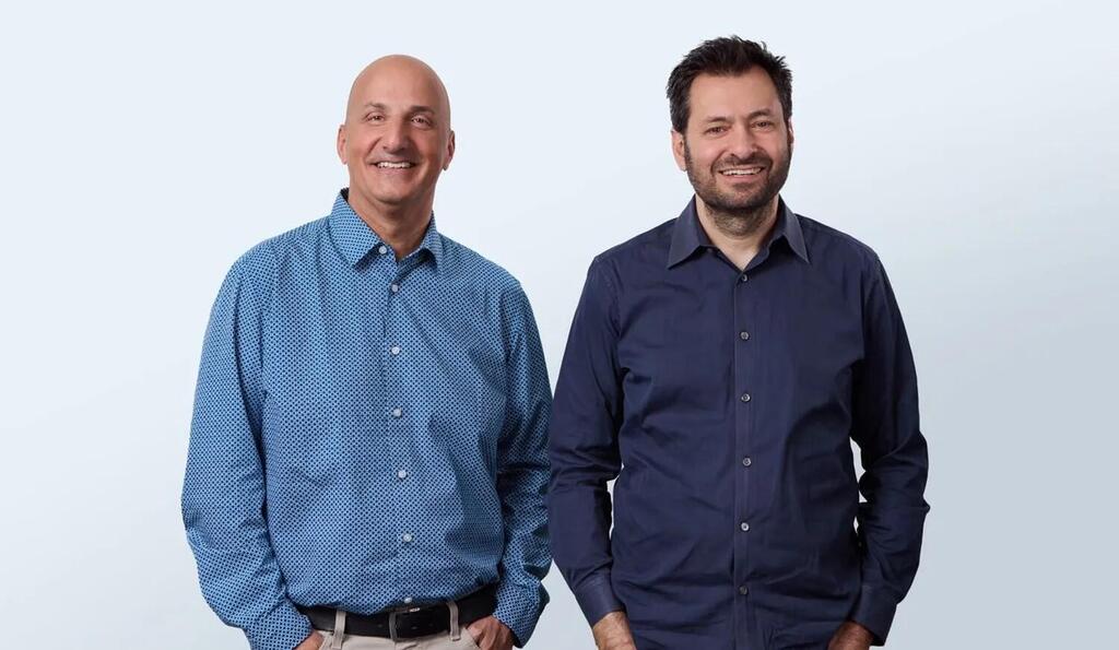 Two K Health founders standing together in a company publicity photograph