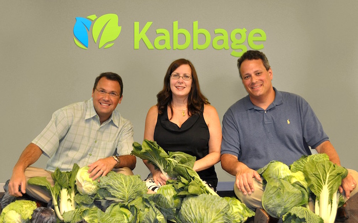 Kabbage co-founders Rob Frohwein, Kathryn Petralia and Marc Gorlin posing with cabbages