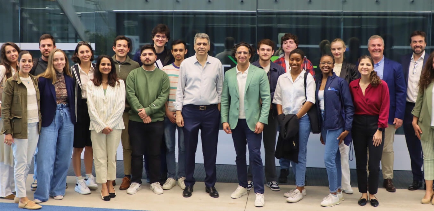 Kabir Barday in a green jacket with Dean Ikhlaq Sidhu and attendees at IE University
