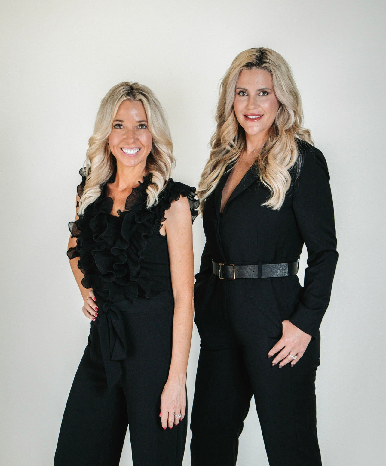 ChicExecs co-founders Nikki Carlson, left, and Kailynn Bowling, right, standing together