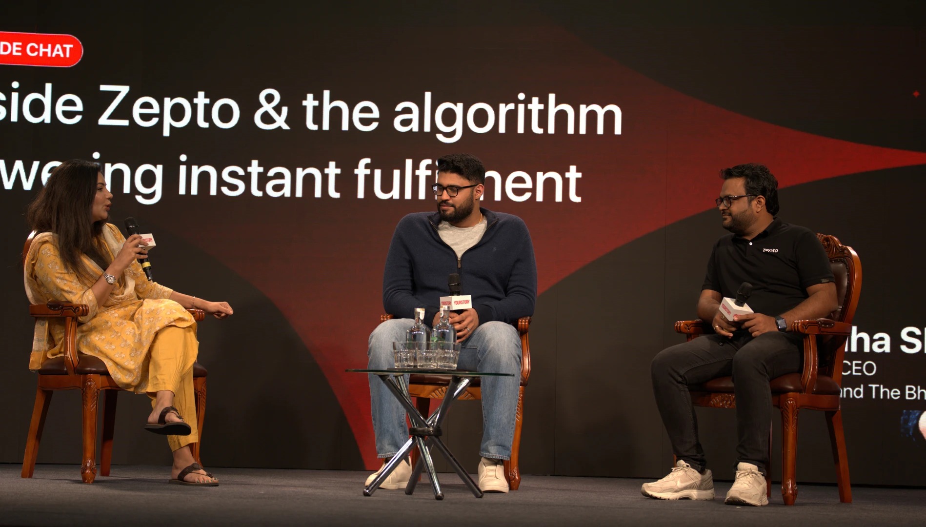 Kaivalya Vohra, center, speaking onstage at a YourStory TechSparks conversation in 2025