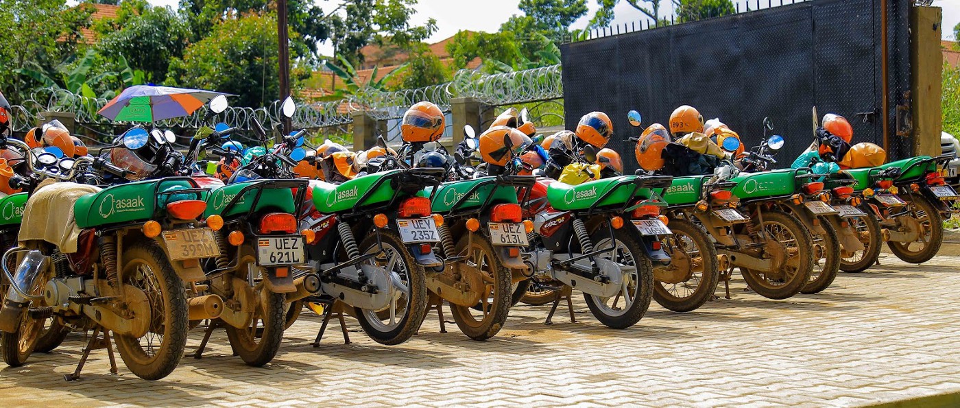 Rows of Asaak motorcycles parked outside its Kampala office