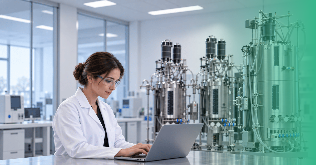 Laboratory illustration featuring a researcher at a laptop beside bioprocessing equipment