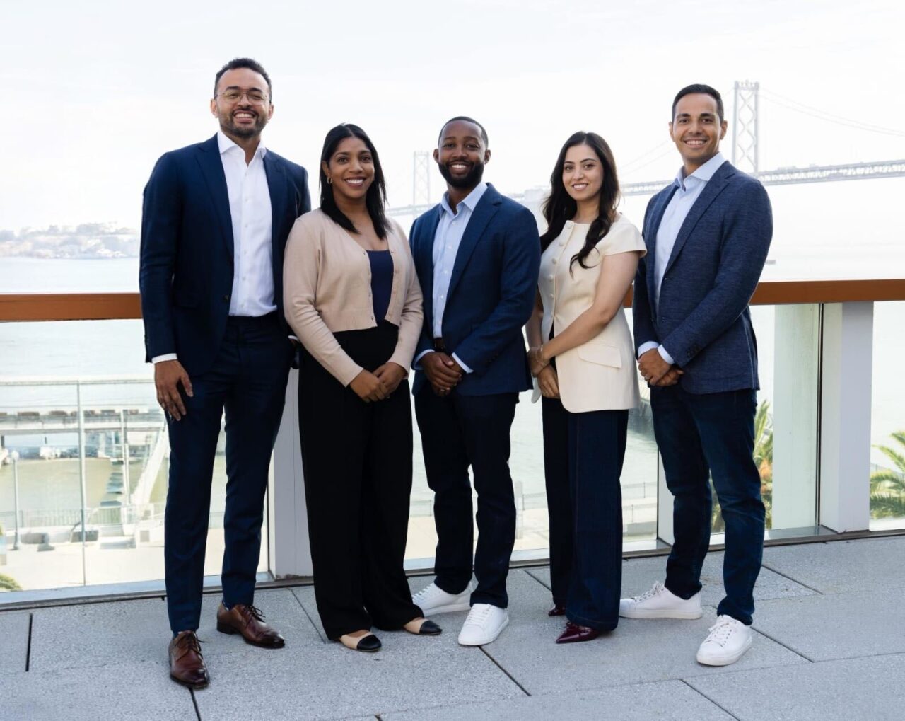 Five members of the Kapor Capital team standing together overlooking the San Francisco Bay