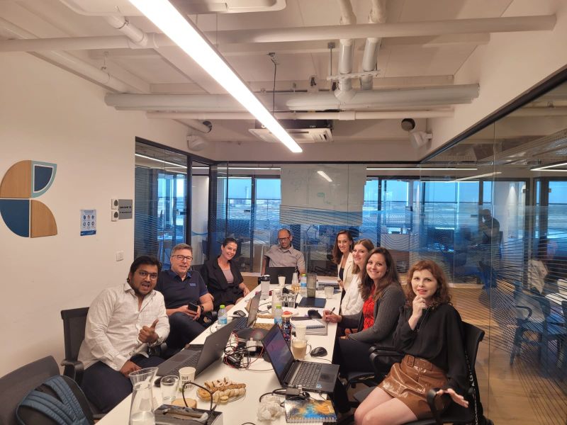 Magic Software colleagues seated around a conference table during a global marketing meeting in Israel