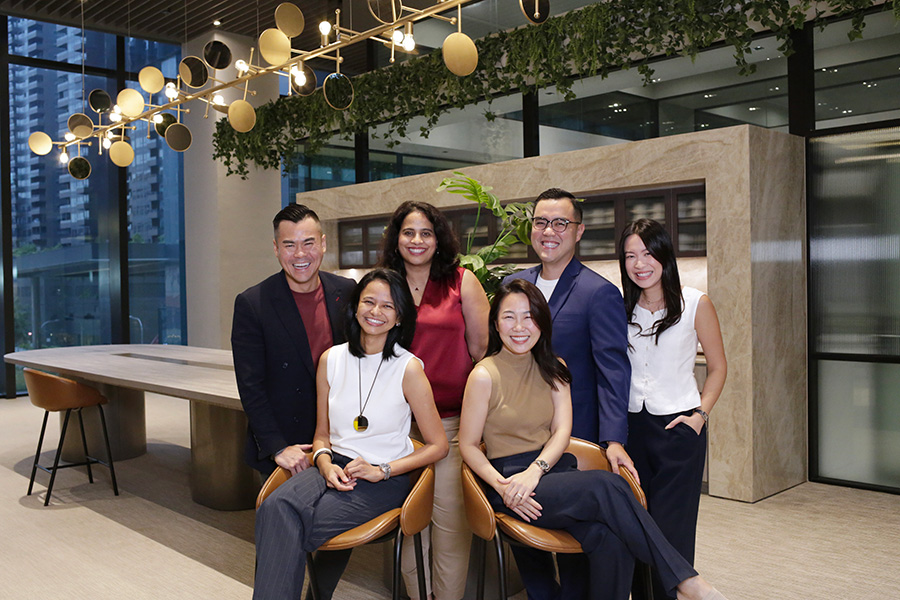HEPMIL and Publicis executives together at the 2025 acquisition announcement; Karl Mak stands second from right.