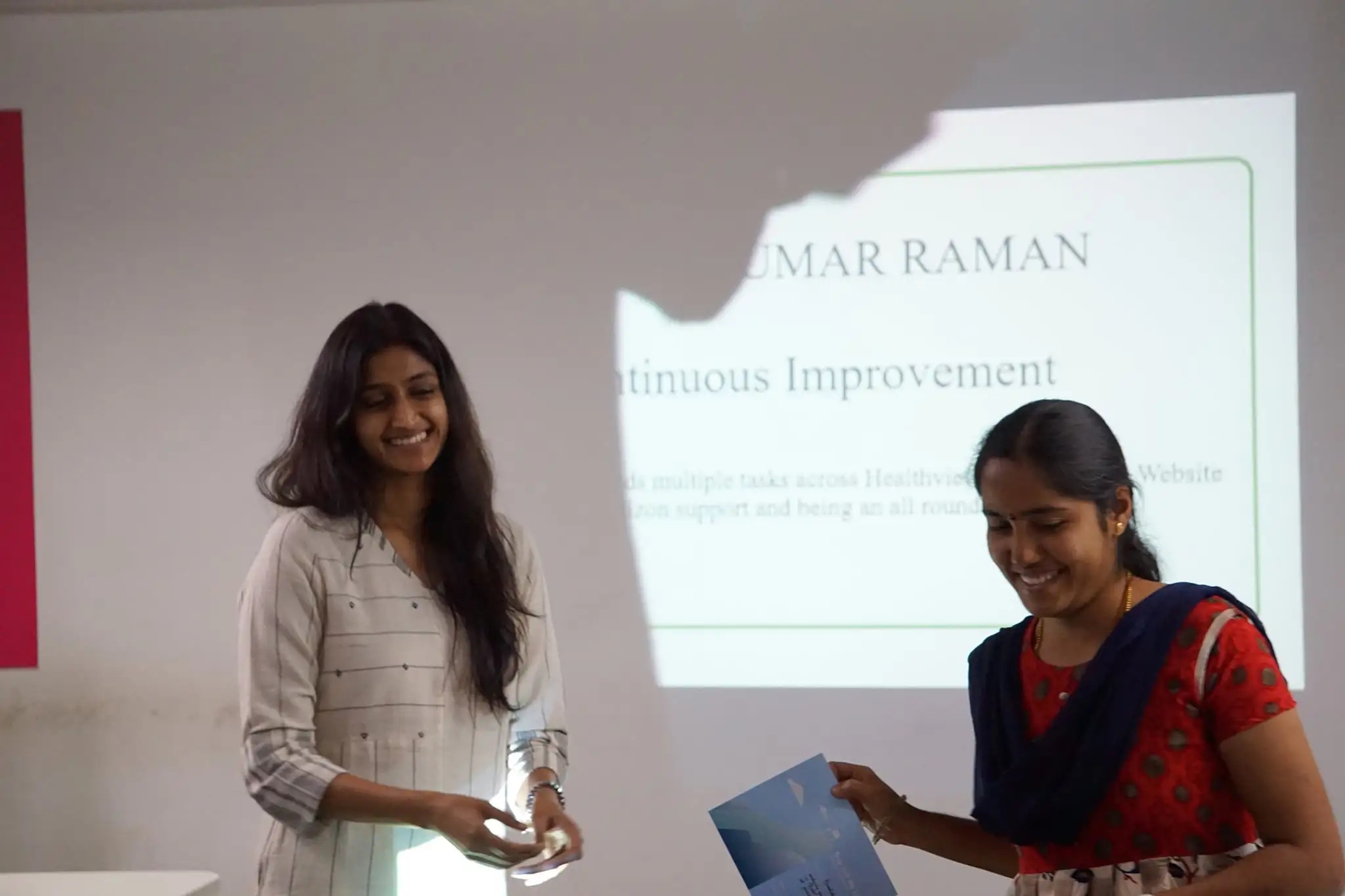 Karunya Sampath, left, with a colleague during a workplace presentation