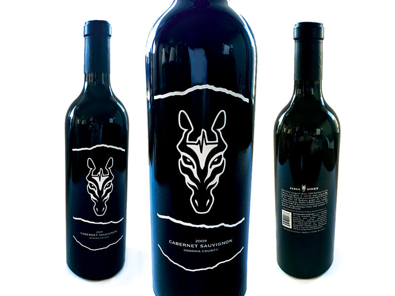 Zebra Vines wine bottles with white zebra-head illustrations on dark labels