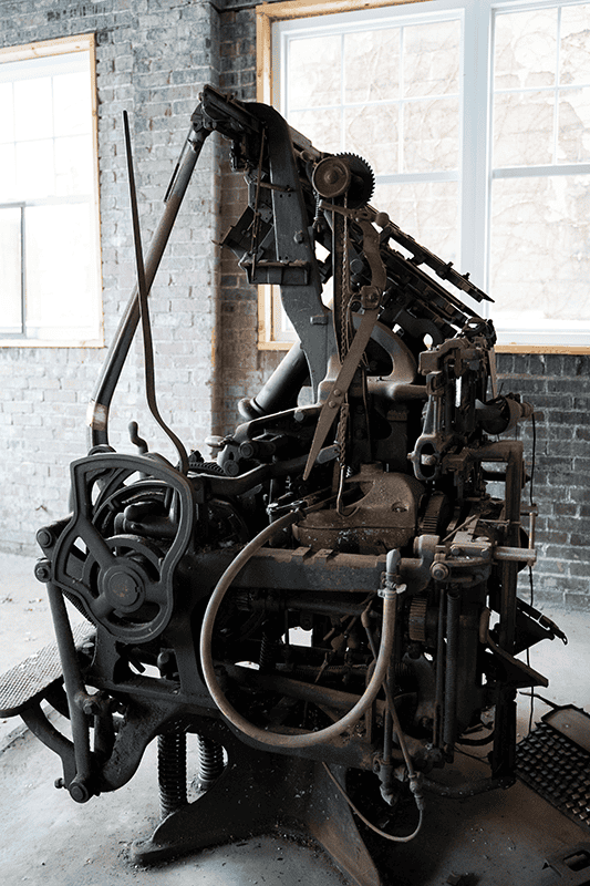 Historic Mergenthaler Linotype printing press preserved inside the future Kate and Company office