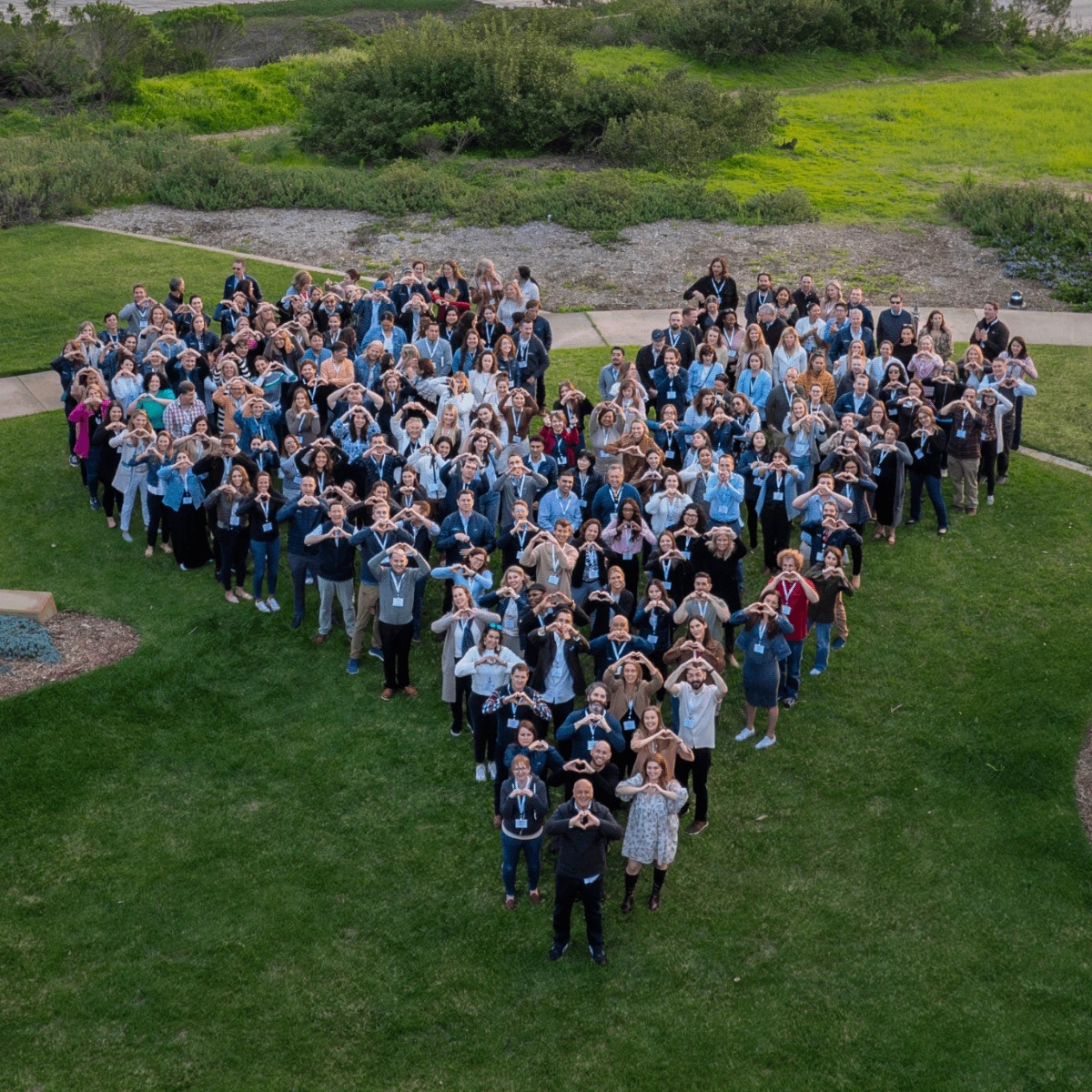 People arranged in a heart shape in an aerial photograph on the Kate Farms website